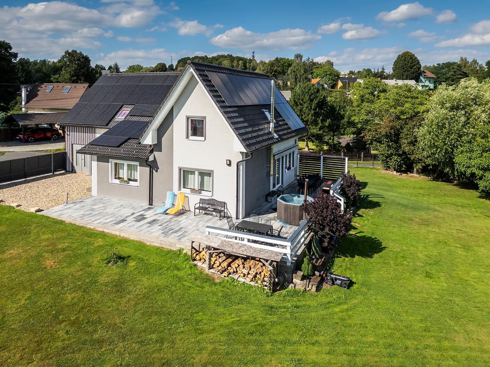 Aerial view of the terrace with the hot tub and the firewood store